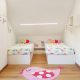 Dormitorio infantil con camas gemelas en color blanco